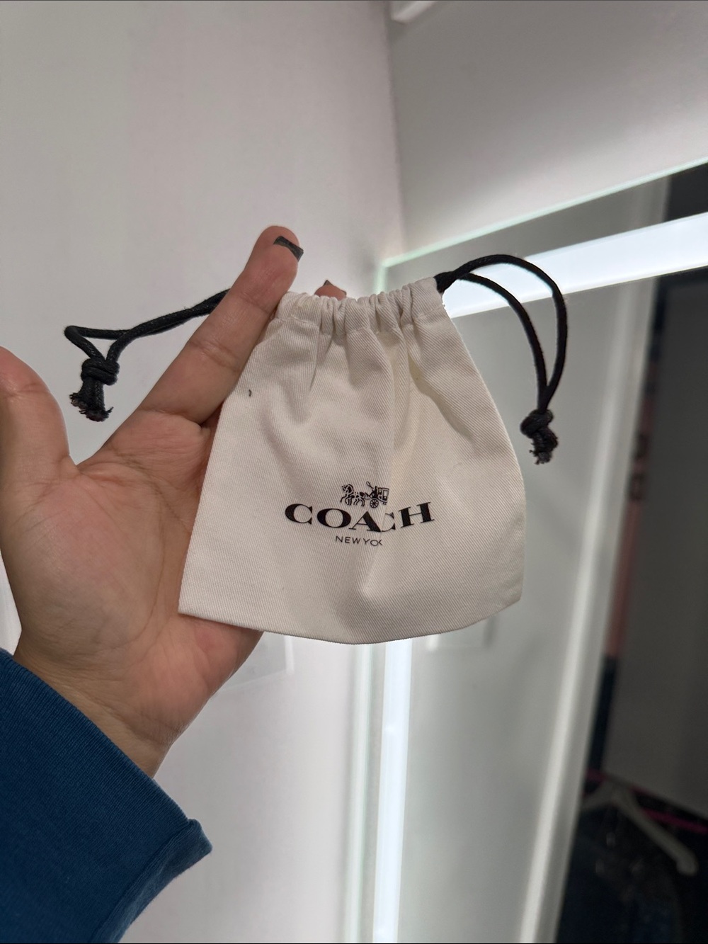 COACH Cream Drawstring Jewelry Pouch with Black Cords